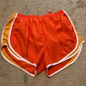 Orange Nike tempo shorts